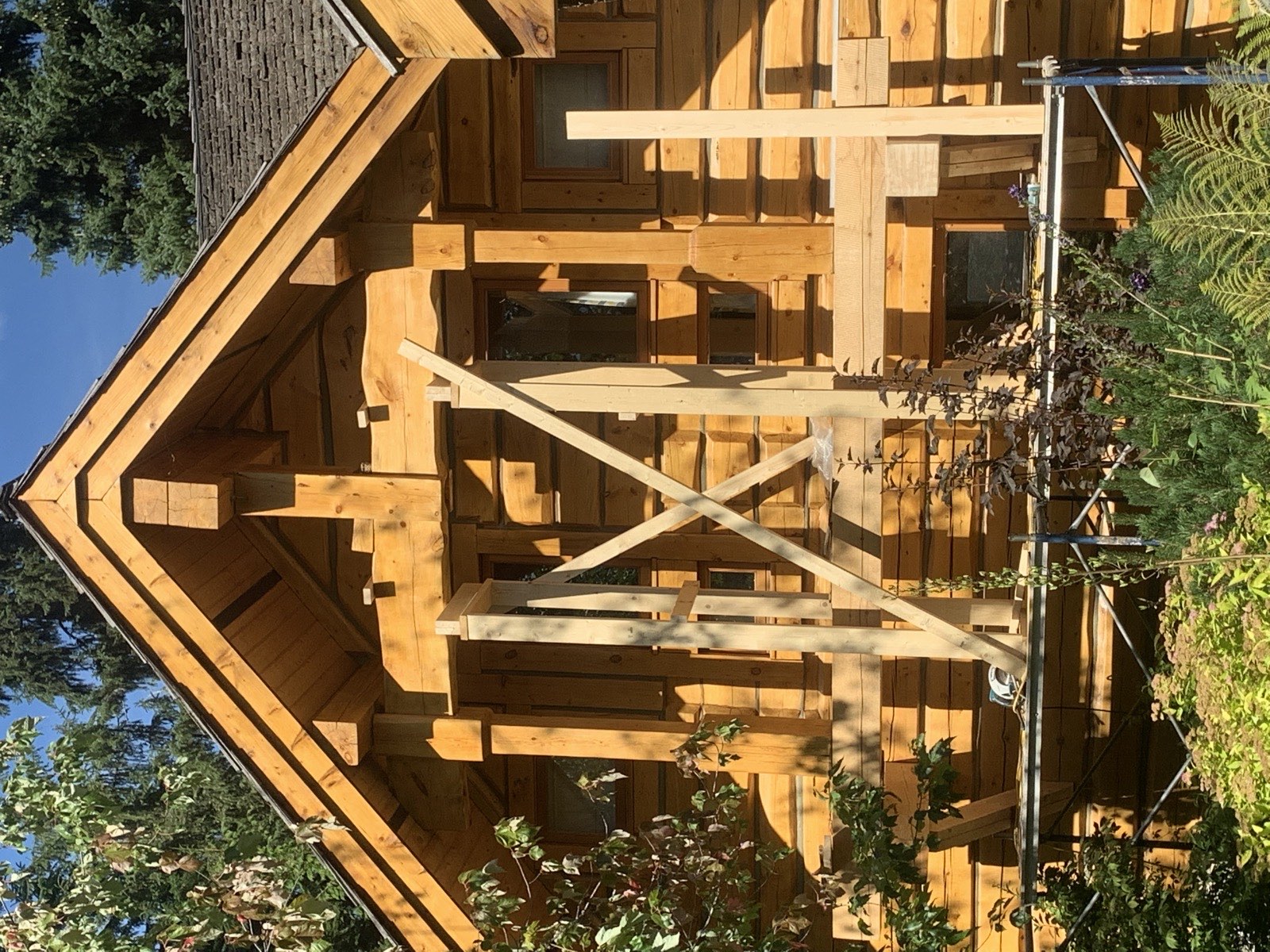 Log home repair Whistler BC - gable end braced during timber restoration work